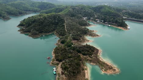 aerial view of lush green islands and turquoise water in a tropical lake landscape