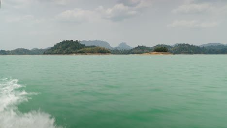scenic turquoise lake with islands and mountains