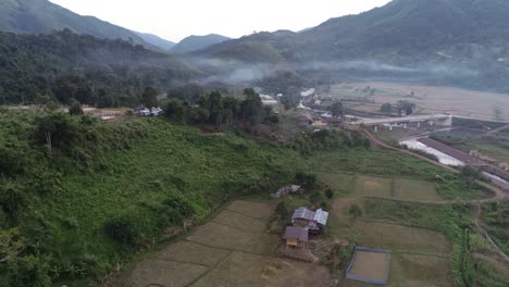 aerial over thailand paddy fields on a misty morning