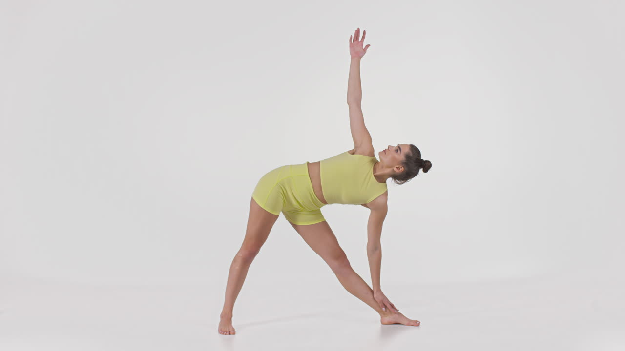 Woman Performing a Triangle Yoga Pose