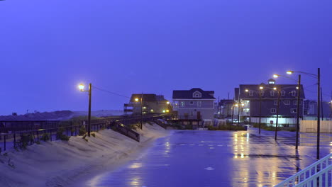 large storm creating epic lightning chain across the sky above a calm parking lot at the beach