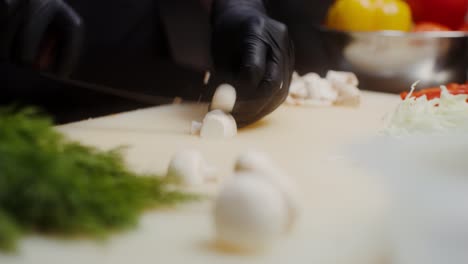 chef chopping mushrooms