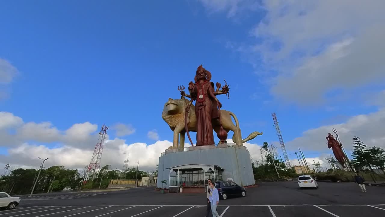 Towering Hindu deity Shiva statue at Grand Bassin sacred lake in Mauritius, a spiritual landmark showcasing the island's rich cultural heritage and religious significance.
