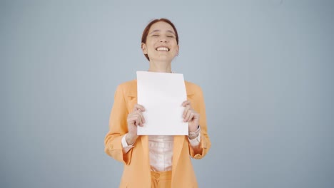 business woman looks at the document in her hand and rejoices.