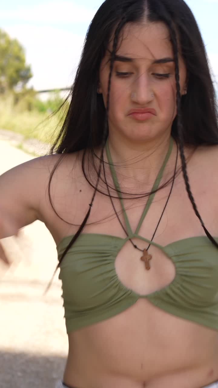 Woman in Crop Top and White Pants on Dirt Road