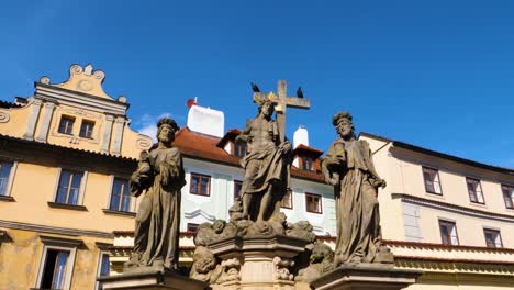 statues of saints cosmas and damian on charles bridge in prague, czech republic