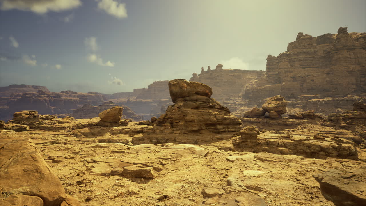 Sunlit desert landscape showcasing unique rock formations and canyon views