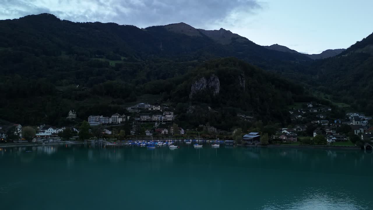 Lake Walen calm freshwater turquoise color alpine landscape houses log cabin