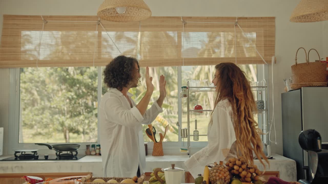 Couple Dancing in a Tropical Kitchen