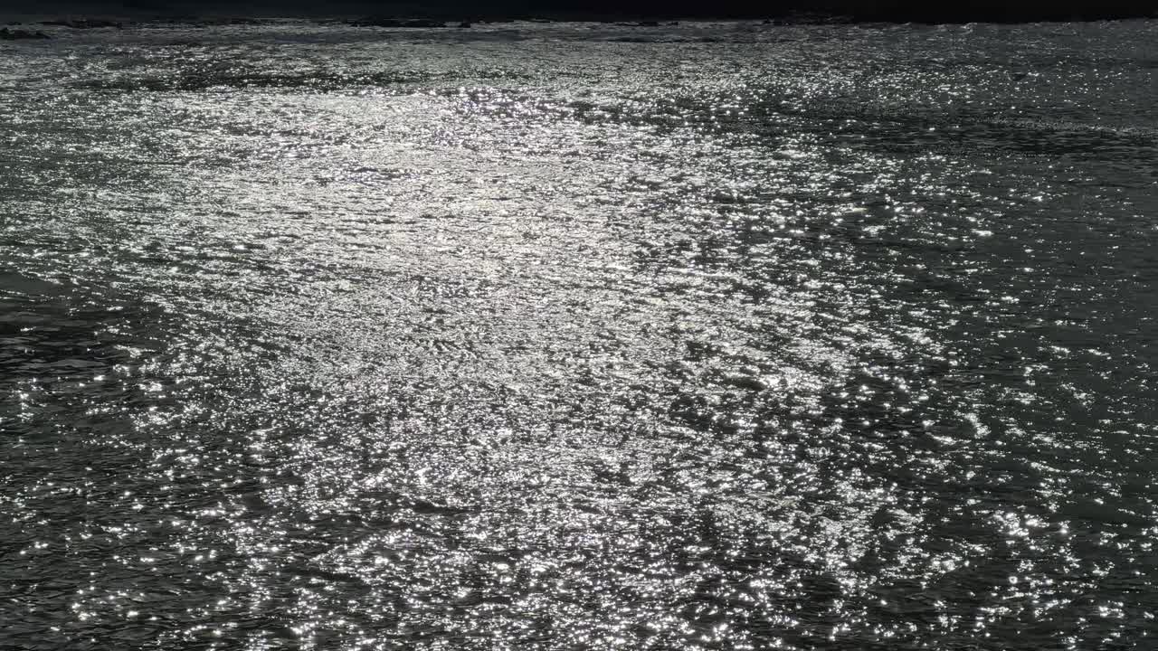 Dancing light on water surface in the harbour at Kalk Bay, near Cape Town.