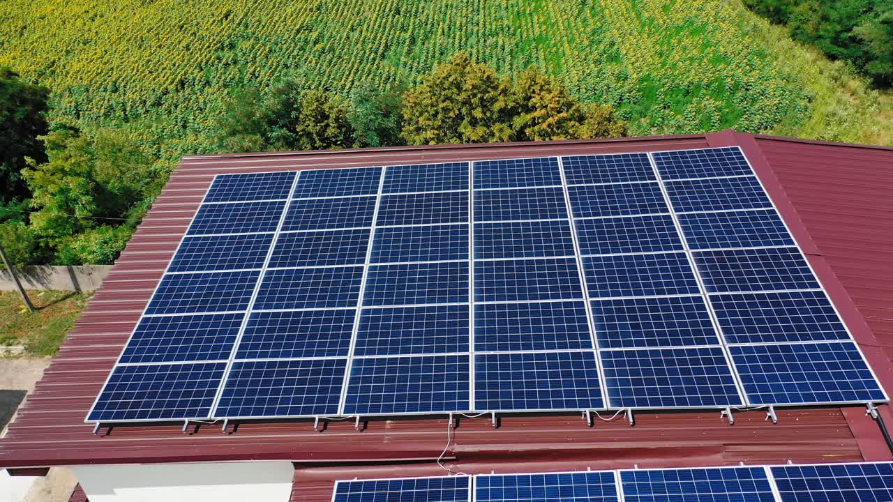 House with solar panels. Aerial view of house roof with solar panels on top