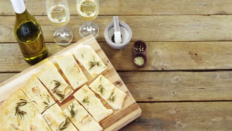 Snacks-on-tray-with-glasses-of-wine-and-wine-bottle