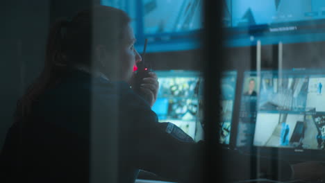 security officer monitoring surveillance screens