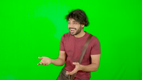 Indian-guy-express-emotion-with-green-background-green-screen