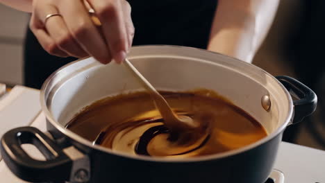 stirring a saucy dish