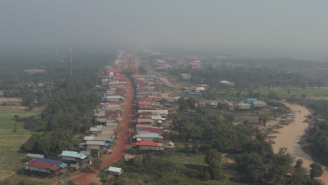 aerial of village on stilts along the tonle sap river