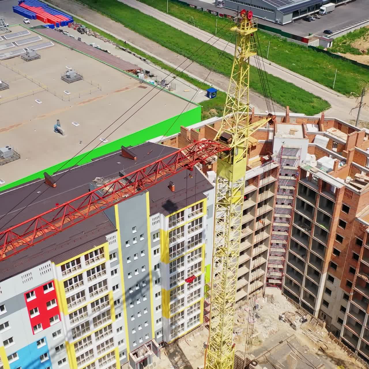Construction site shot from above. Aerial view of new residential building under construction