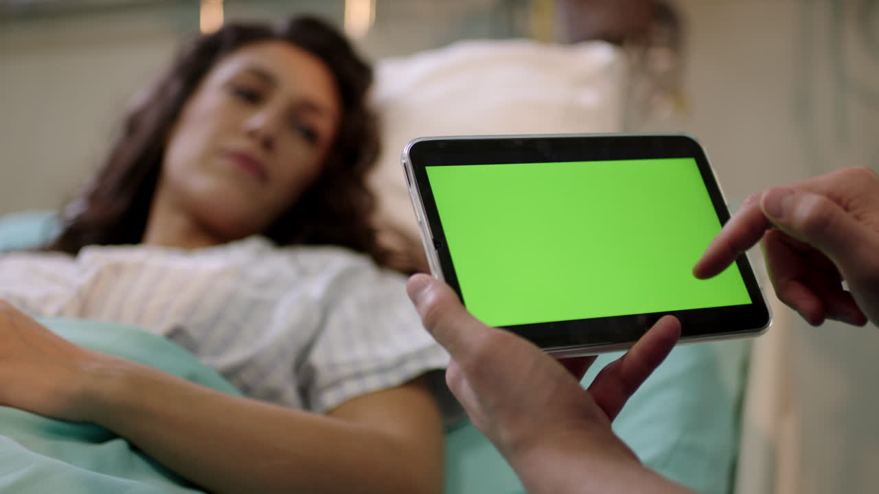 Patient with Tablet in Hospital Bed