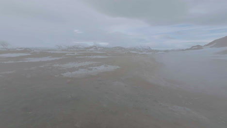 Flying-to-Vapor-in-Geyser-Geothermal-Land,-Iceland,-Drone-Shot
