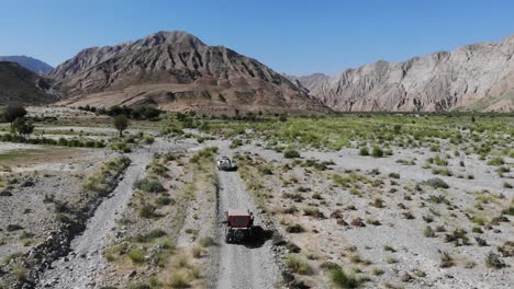 aerial shot of car running in the mountain road in the morning time