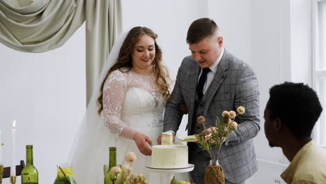 Bride-and-groom-cutting-the-wedding-cake