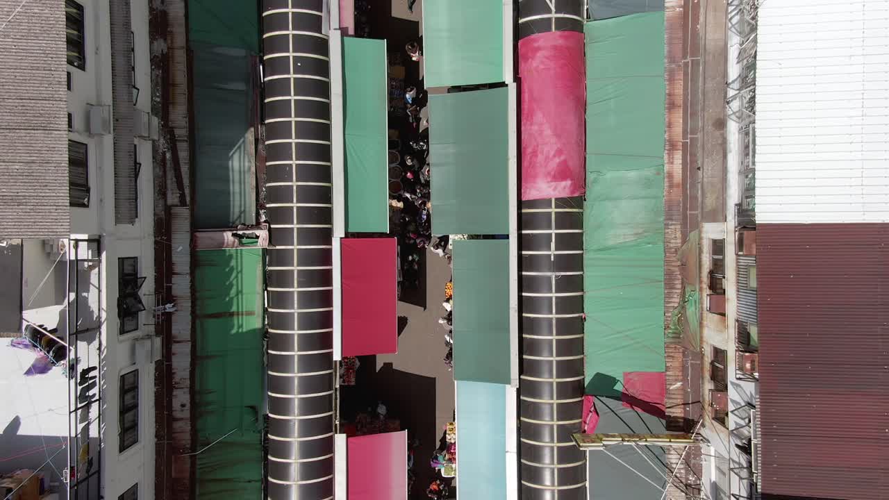 Aerial view of Ngau Chi Wan wet market rooftops, downtown Hong Kong with fresh Meat and Fish stalls.