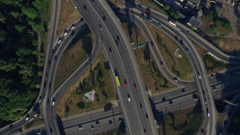 Car-driving-on-freeway-overpass.-Aerial-view-car-traffic-on-roundabout-highway