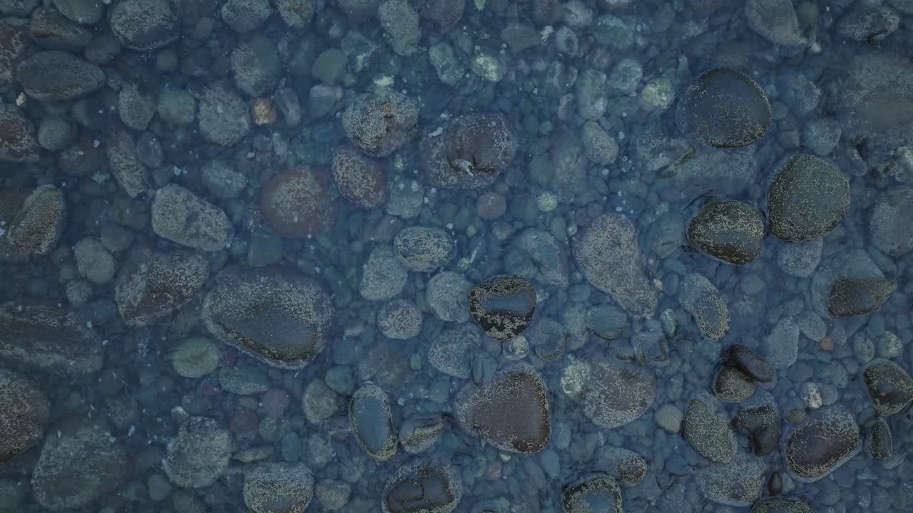 Aerial Top Down Drone view of waves and rocks at La Bocana El Tunco El Salvador
