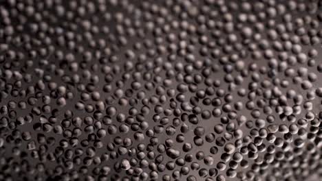 close-up view of small dark gray beads