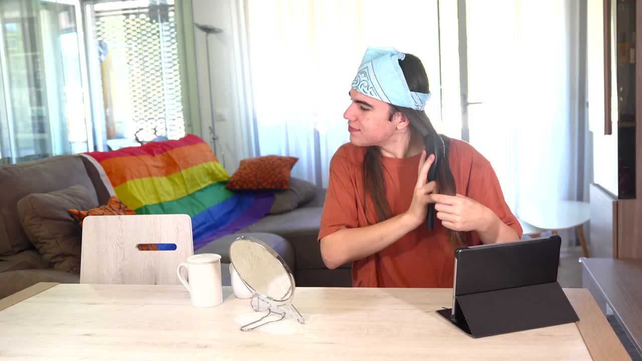 Person grooming at home with rainbow flag