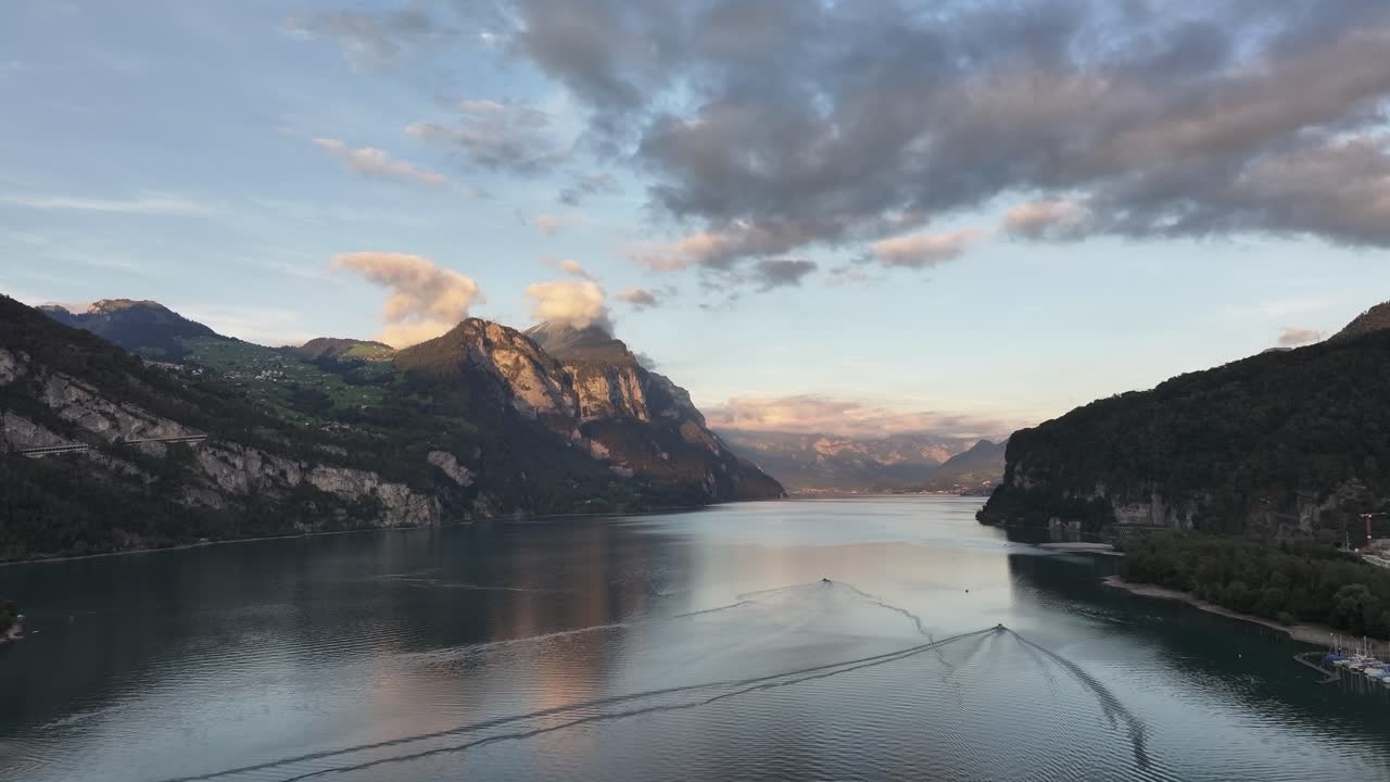 Panoramic view of Walensee, Glarus Nord, Switzerland, with calm waters and mountains at sunset