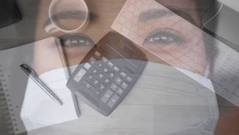 Paperwork-and-calculator-over-woman-with-mask.