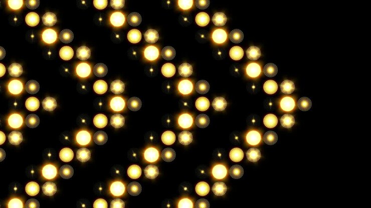 Sfondo di luci LED con motivo a freccia dorata in movimento laterale.