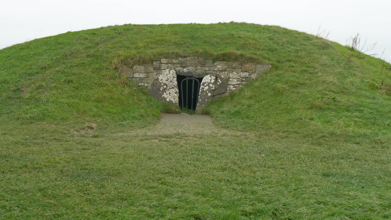 Stone Entrance With Metal Gate At The Mound Of The Hostages - Hill Of Tara In County Meath, Ireland. drone shot
