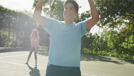 video of happy biracial couple playing tennis on the court