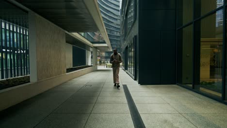 man walking in city corridor