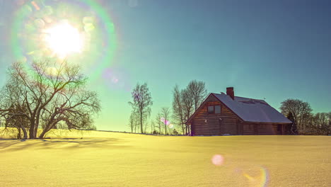 Day-to-night-timelapse,-stunning-sunset-behind-rustic-log-cabin-in-winter