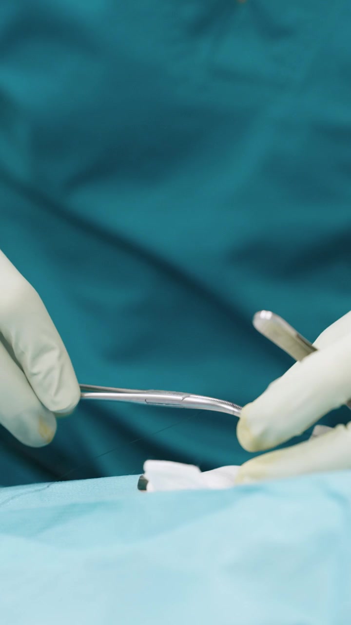 Surgeon Performing Surgical Suturing Procedure in Operating Room