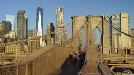 walking the brooklyn bridge with stunning views of the manhattan skyline