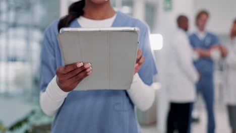 healthcare professionals using a tablet in a hospital setting