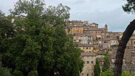 A-pan-across-the-skyline-of-the-old-city-of-Perugia,-Province-of-Perugia,-Italy