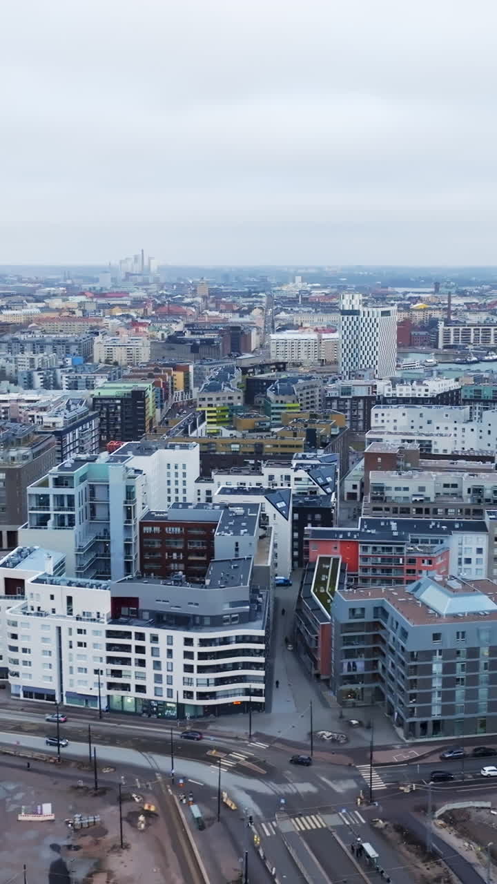 Vertical aerial over the Jatkasaari cityscape, cloudy day in Helsinki, Finland