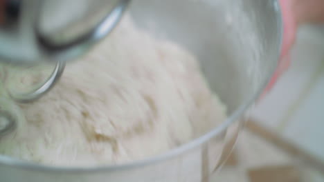mixing pizza dough in a stand mixer