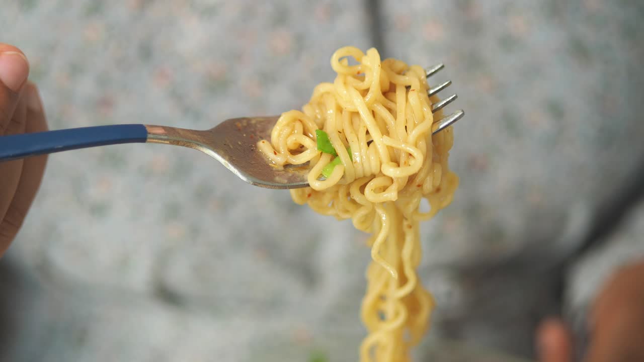 Close-up of noodles on a fork