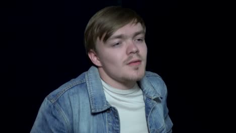 young man in denim jacket