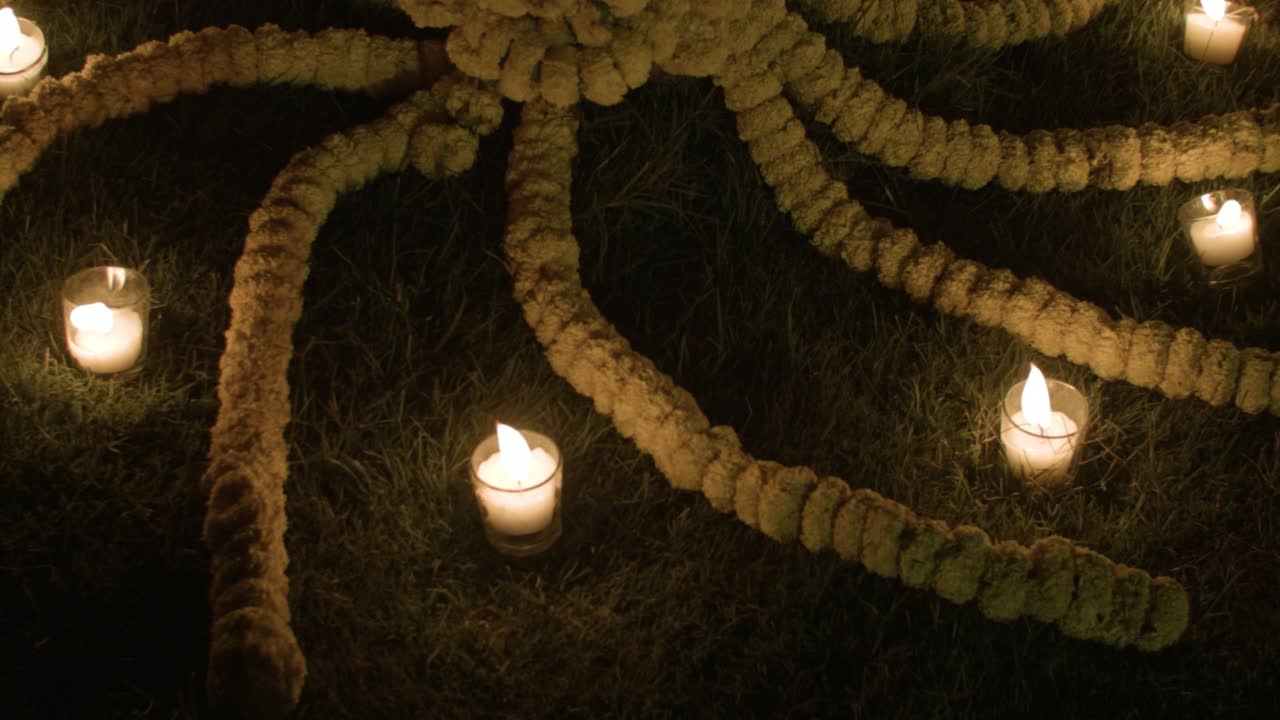 Floral Arrangement with Candles at Night