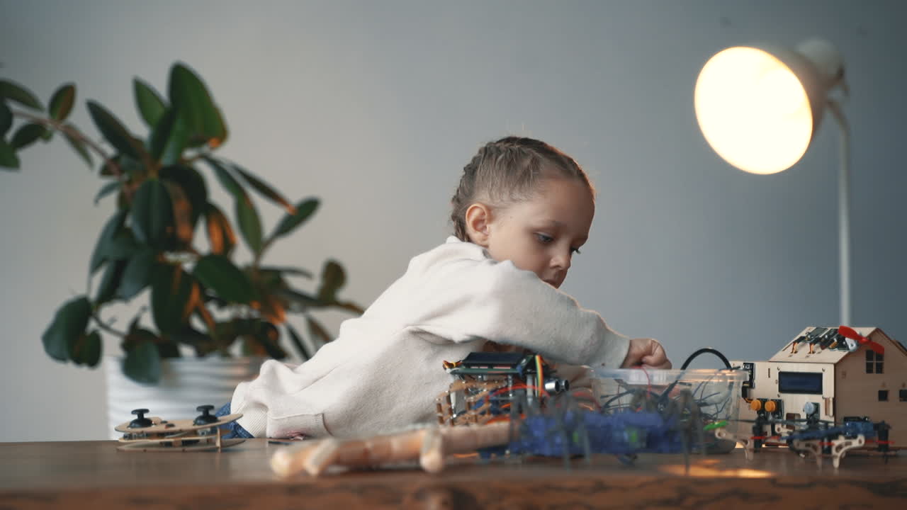 Little Girl Building Robots