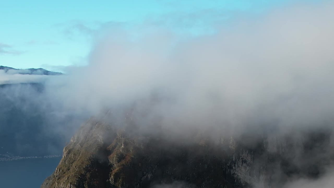 Aerial view of cloudy mountain peaks in the Italian Alps