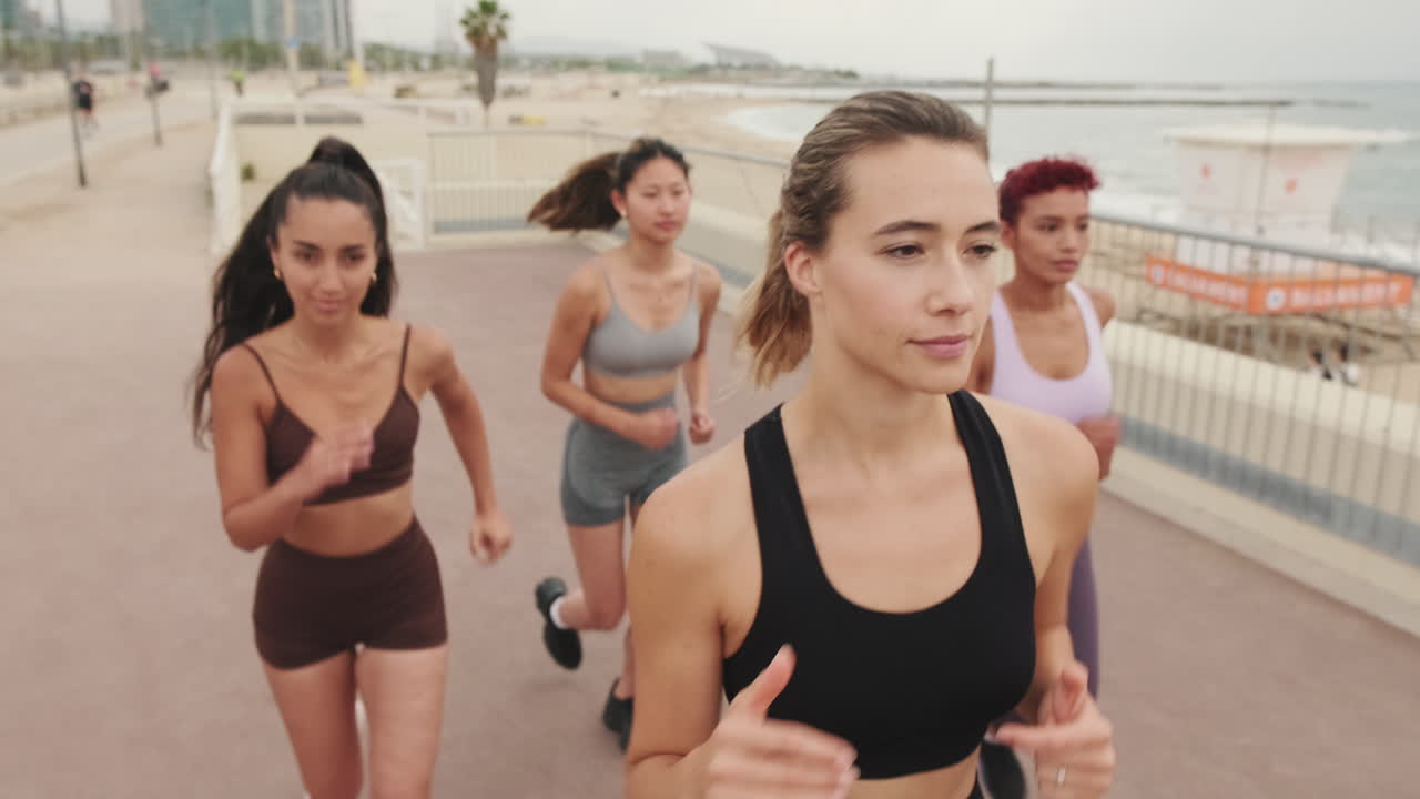 Women Running on Beach: Fitness and Friendship