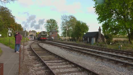 historic steam train passing on the tracks of east somerset railway, england